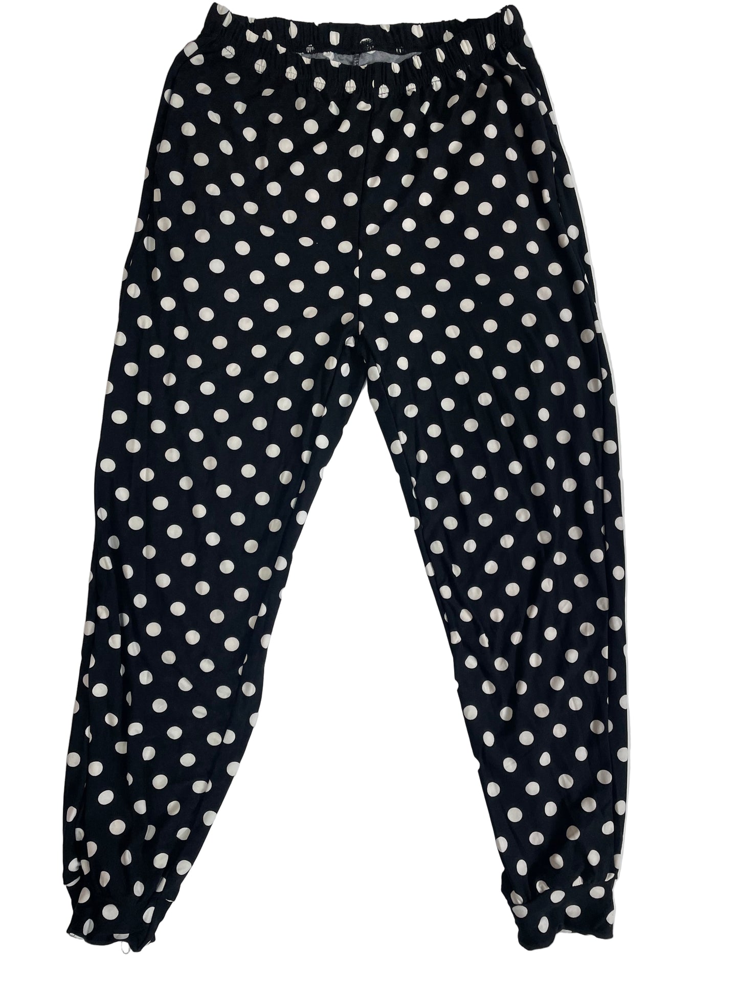 Black pants with white polka dots on a white background