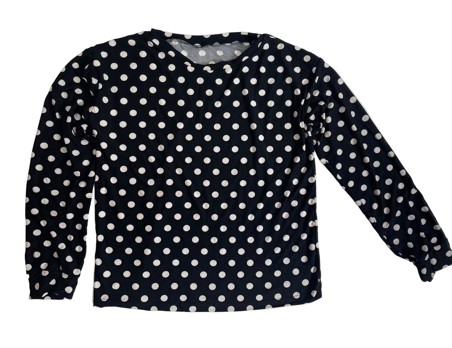 Black long-sleeve shirt with white polka dots on a white background