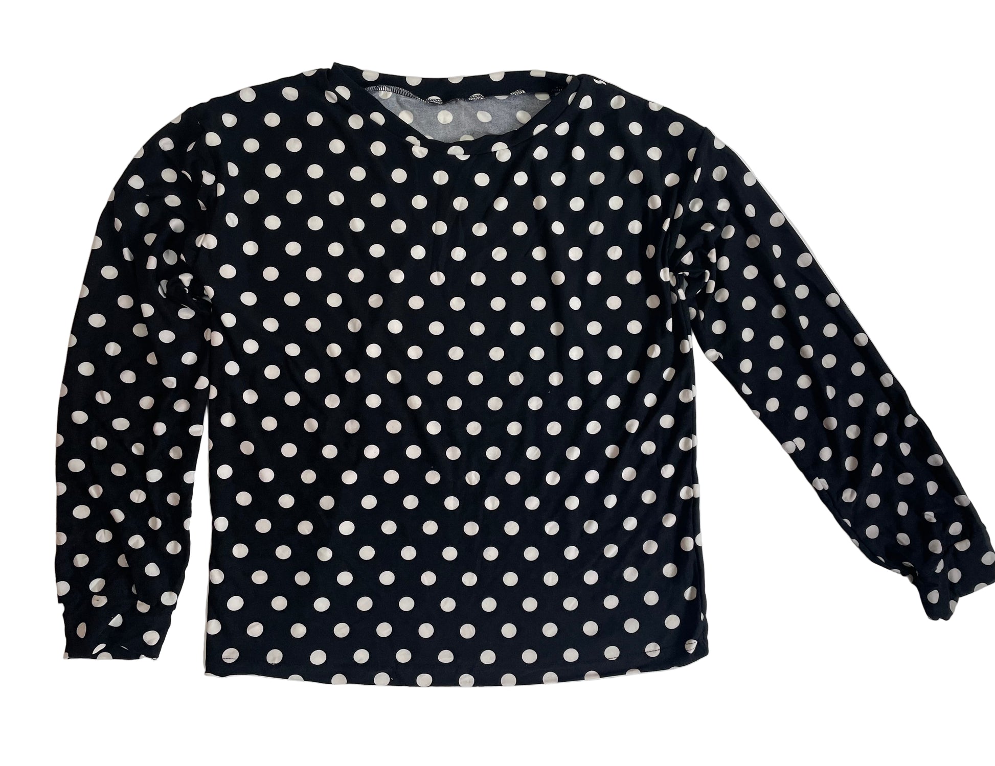Black long-sleeve shirt with white polka dots on a white background